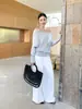 Suéter Tejido Jianhe 2026 Primavera Estilo Minimalista Versátil Usable Hombros Descubiertos Manga Murciélago de Tencel para Mujer 59306