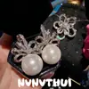 Set de Banquete de Joyería Pendientes de perla blanco roto con forma de cinta incrustados con diamantes Colgantes de oreja de perla de concha de girasol con detalles de diamante