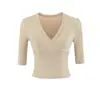 Camiseta básica sexy versátil de cuello en V escotada ajustada de manga media + conjunto de falda midi ajustada estilizante