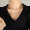Collar europeo y americano para mujer, sonrisa, circonita, collar apilado de doble capa, collar para clavícula femenino de acero de titanio chapado en oro P943