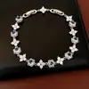 Pulseira de Ouro Real 18K Banhada a Zircônia Flor Redonda com Fecho, Pulseira de Nicho de Luxo Leve, Joia de Mão Exquisita e Elegante Atacado