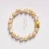Estilo étnico año del dragón Chengxiang pan de oro esmalte de color pulsera DIY templo con cuentas pulsera simple para hombres y mujeres venta al por mayor