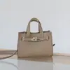Nuevo bolso Kelly de nicho de cuero genuino para mujer, bolso tote transfronterizo TC de capa superior de piel de vaca, bolso de mano informal para el día a día y bolso cruzado