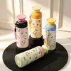 Nueva taza termo de acero inoxidable con diseño de cachorro de dibujos animados y asa, taza de agua portátil para estudiantes, taza termo de alta estética en colores caramelo
