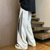Pantalones retro americanos para hombre, pantalones de retazos a rayas de moda para primavera y otoño, pantalones deportivos casuales holgados de alta costura, a la moda