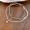 Colar de pérolas multicamadas vintage francês, luxo leve, moda de alta qualidade, corrente requintada para clavícula, acessório de nicho único e versátil