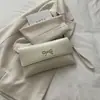 Bolso casual de moda estilo retro para mujer, nuevo bolso de mano de otoño 2026, bolso cuadrado pequeño versátil, bolso de mano de nicho versión coreana