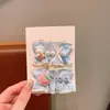 Lindo pasador de pelo Sanrio de color caramelo para niñas, pasador totalmente cubierto de tela, accesorio para el pelo de bebé