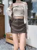 Falda Corta de Piel Sintética Negra para Mujer, Nuevo Estilo Otoño/Invierno 2026, Cintura Alta, Adelgazante, Versátil, Línea A, Ceñida a la Cadera, Falda Corta
