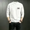 Camiseta blanca de manga larga para hombre, nuevo estilo otoño/invierno 2026, corte holgado, capa base, ropa interior, top casual para adolescentes