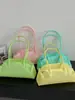 Bolsa de Mão de Gelatina Transparente Tendência Verão 2026 Feminina Moda Alta Qualidade Texturizada Ombro Axila
