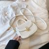 Elegante textura crossbody bolsa pequena para as mulheres 2024 primavera e verão novo all-match saco de ombro estilo ocidental saco de selim portátil