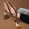 Duobao molienda seca material antiguo meteorización pulsera raíz de Bodhi jade blanco estilo Xingshi enrollado suave hombres y mujeres pulsera de cuentas de Buda sosteniendo