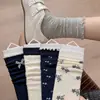 Calcetines de encaje de lunares grises de moda para mujer, otoño e invierno, con accesorios de lazo, calcetines elegantes hasta la pantorrilla