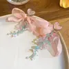 Flor de chifre com agulha de prata Flor com contas Laço de flor Brincos com borla redonda Brincos de tarraxa versáteis e elegantes Brincos de nicho de luxo leve