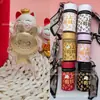 Colgante de oro popular Labubu de oro puro 999, serie de bolsos tipo cubo "Hazte Rico Rápido" con cordón, atrayendo clientes a través de transmisiones en vivo de Douyin