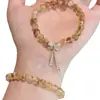 Pulsera de Hilo Elástico con Borla y Lazo de Cristal Amarillo Natural para Mujer, Exquisita, Dulce, de Nicho, Estilo Lujo Ligero