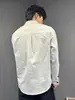 Nuevo cárdigan de manga larga color albaricoque con cuello mao estilo chino, modelo 2026, para hombre, uso en las cuatro estaciones, estilo ligeramente maduro, camisa única y no repetitiva