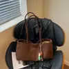 2026 Nova Bolsa de Ombro de Lona com Alça Longa Estilo Retrô Grande Capacidade Casual Versátil Bolsa de Mão Simples Elegante Bolsa de Ombro