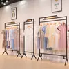 Perchero moderno simple de piso estante multicapa simple estante para ropa de mujer soporte de exhibición de ropa de hierro venta al por mayor