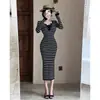 Vestido Tejido Elegante Transfronterizo de Cuello Semiabierto 2025 Otoño Nuevo para Mujer Ajustado al Cuerpo Ceñido a la Cadera Suéter Falda Larga