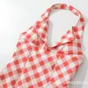 Comércio Exterior Transfronteiriço Roupas Femininas 2026 Novo Estilo Doce Francês Vestido de Gola Halter com Estampa Xadrez Vermelho, Linha A, Costas Abertas, com Cintura Marcada e Saia Curta