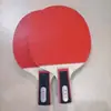 Rackets de tenis de mesa directas de fábrica doble para niños de primaria principiantes entrenamiento 2 rackets obtén 3 pelotas bolsa para rackets venta al por mayor