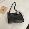 Bolsa Tipo Dumpling 2026 Nuevo Tejido de Nailon Simple Versátil Gran Capacidad Bolso de Hombro Cruzado de Moda Minimalista para Mujer Transfronterizo