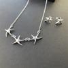 Collar y pendientes de estrella de mar de joyería de comercio exterior, adecuados para Europa y Estados Unidos, oferta en stock, venta al por mayor T138