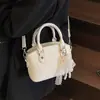Bolso Cruzado de Concha para Mujer Bolso Cubo Estilo Nuevo 2025 Patrón Granulado Gran Capacidad Cruzado Moda Portátil Bolsa para Clase y Viajes