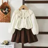 Nuevo Conjunto de Primavera y Otoño para Niñas: Conjunto de Dos Piezas de Camisa de Manga Larga y Falda Corta con Cuello de Encaje Dulce y Lindo, Ropa Infantil Transfronteriza