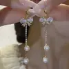 Brincos Super Fada com Laço e Borlas Longas para Mulheres 2026 Novos Brincos Perolados da Moda Elegantes Versáteis Emagrecedores