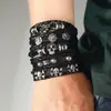 Pulsera popular de estilo punk exagerado para hombre, europea y americana, con accesorios de calavera y remaches, pulsera de conjunto multicapa