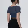 Camiseta deportiva de malla sintética tipo dos piezas disponible en stock con mangas cortas y almohadillas en el pecho, top de yoga, top corto, ropa de fitness adelgazante de secado rápido