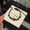 Nuevo Pulsera de Grullas de Papel Tejidas Chinas Negra y Blanca Pareja Mejor Amigo Cuerda de Mano Simple Versátil Ajustable Pulsera de Grullas de Papel