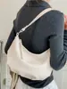 Bolsa estilosa de nicho Shuai Mi Jia para mulheres, novo modelo de verão 2026, bolsa simples tipo bolinho de ombro, bolsa de ombro e transversal