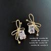 Pendientes deslumbrantes de lazo con gemas chapados en oro de 18 quilates pendientes de anillo de ocho corazones y ocho flechas pendientes de cruz