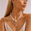 Novo conjunto de colar e brincos de flor de pérola da moda Europa e Estados Unidos transfronteiriço popular joias femininas liga galvanizada