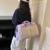 Diseño de tendencia transfronterizo sentido de diseño bolsa de viaje para mujer gran capacidad bloques de color empalmados bolsa de fitness bolsa de equipaje de mano para viaje de negocios de corta distancia
