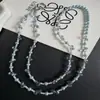 Cadena para teléfono larga de perlas en forma de gota, a la moda y versátil, con un diseño de nicho, que ofrece una sensación de alta gama y elegancia para el uso diario y como accesorio para bolso.