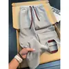 Pantalones casuales de jacquard texturizado de color de contraste con múltiples bolsillos para hombre, estilo americano, otoño, finos, transpirables, rectos, holgados, de pierna ancha