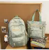 2025 Nueva Mochila Casual Coreana Texturizada de Gran Capacidad Versátil con Múltiples Compartimentos Mochila Escolar Estampada Mochila Casual