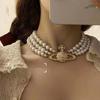 Gloria oscura Yan Jane collar de perlas estilo Cixi retro europeo y americano exagerado cadena clavicular llena de Saturno