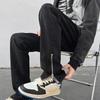 Pantalones vaqueros con abertura y cremallera en negro puro con estilo americano para hombre, pantalones ajustados de estilo urbano europeo y americano de verano.