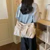 Bolsa de lona grande para mujer, bolso de hombro versátil para el día a día, bolso cruzado casual y simple, nuevo bolso de mano 2026
