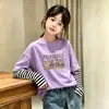 Camiseta de manga larga para niña, colección primavera/otoño 2026, estilo nuevo para niños mayores, base de algodón puro, top casual con diseño de imitación de dos piezas