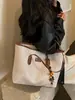 Bolso tejido de patrón retro de moda transfronterizo para mujer 2026 nuevo bolso de hombro para el trabajo bolso de mano de gran capacidad bolso tote moderno