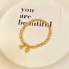 Loja Dourada Mesmo Estilo Ouro Antigo Pulseira Felicidade de Dois Mundos para Mulheres, Pulseira de Lótus e Vagem de Lótus, Joias de Luxo Leve de Nicho de Alta Qualidade