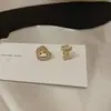 Nuevos pendientes de amor asimétricos 2023, aguja de plata S925, diseño de nicho femenino, clip para oreja compacto de moda, venta al por mayor