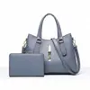Bolso de mano de bajo perfil de alta gama para madre e hija, tendencia europea y americana 2026, para ir al trabajo y viajar, bolso bandolera versátil, suministro del fabricante